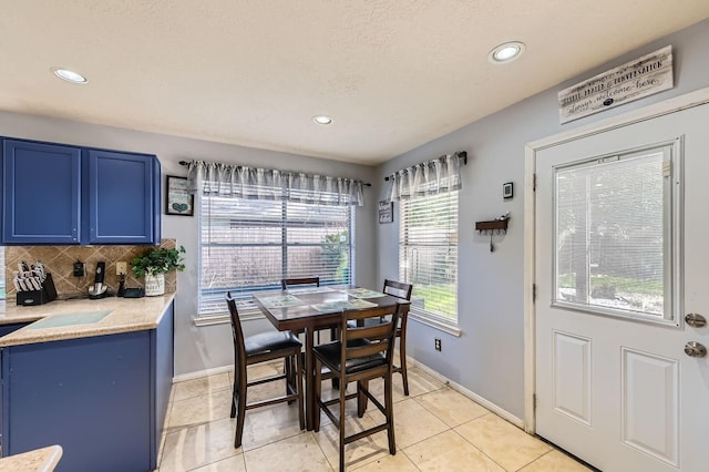 16307 Mango Ridge Ct, Humble, TX 77396 - dining area with light tile patterned floors and recessed lighting