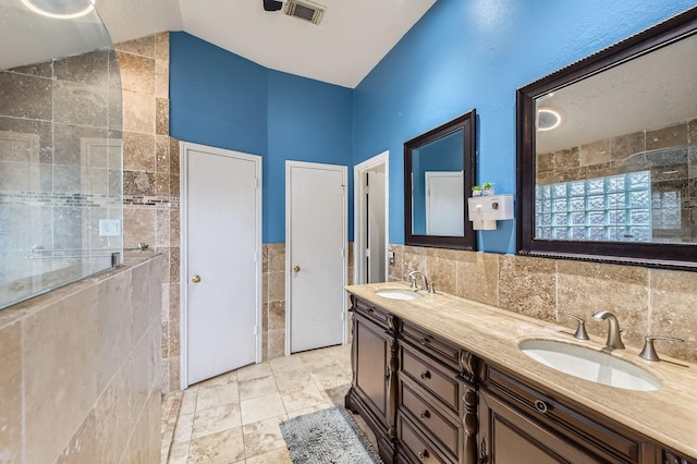16307 Mango Ridge Ct, Humble, TX 77396 - bathroom with tile walls, double vanity, and a tile shower