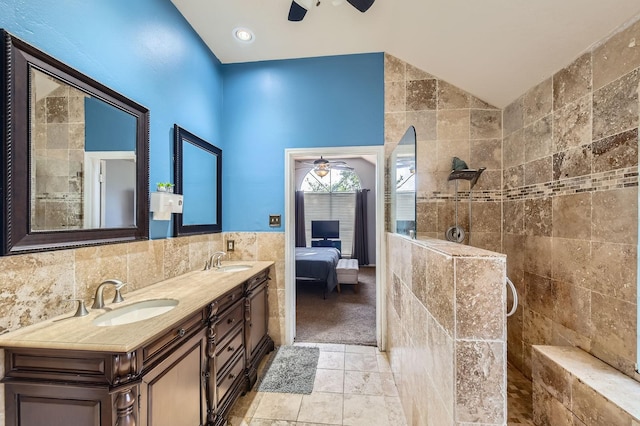 16307 Mango Ridge Ct, Humble, TX 77396 - ensuite bathroom featuring a ceiling fan, tile walls, double vanity, and a tile shower