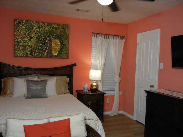 4822 Edgegate Dr, Spring, TX 77373 - bedroom featuring wood finished floors and ceiling fan