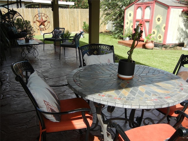 4822 Edgegate Dr, Spring, TX 77373 - view of patio / terrace featuring a shed and outdoor dining space