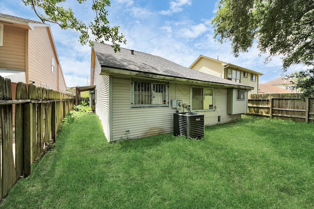 15147 Sheffield Ter, Channelview, TX 77530 - back of house with a shingled roof and a fenced backyard