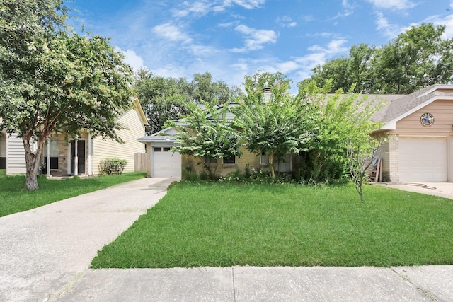 15147 Sheffield Ter, Channelview, TX 77530 - view of front of home featuring concrete driveway, a garage, a front yard, brick siding, and a chimney