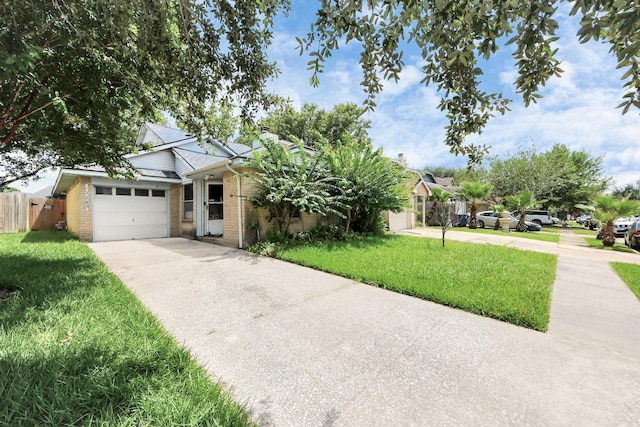 15147 Sheffield Ter, Channelview, TX 77530 - view of front of property featuring driveway, brick siding, and a garage