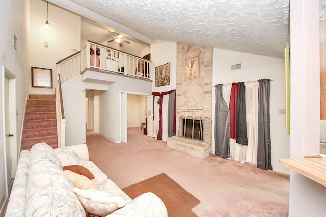 15147 Sheffield Ter, Channelview, TX 77530 - living area featuring carpet, a textured ceiling, a brick fireplace, a ceiling fan, and high vaulted ceiling