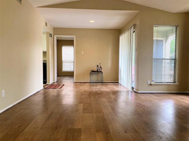6602 Harbor Town Dr Unit 1008, Houston, TX 77036 - unfurnished living room featuring healthy amount of natural light and wood finished floors