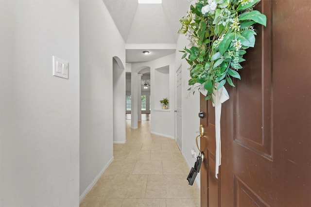 21327 Hadrian Dr, Katy, TX 77449 - foyer with arched walkways and light tile patterned floors