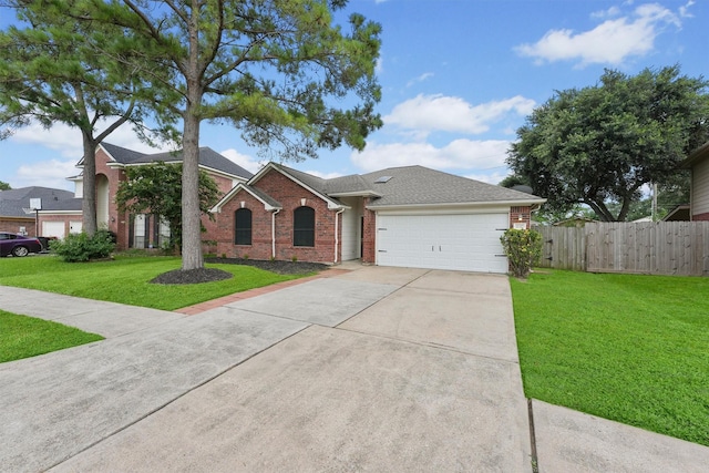 21327 Hadrian Dr, Katy, TX 77449 - view of front facade featuring driveway, a garage, brick siding, and a shingled roof
