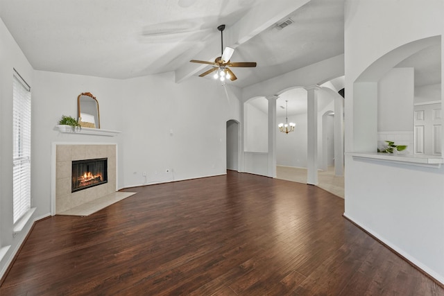 21327 Hadrian Dr, Katy, TX 77449 - unfurnished living room featuring a tiled fireplace, ceiling fan, wood finished floors, and plenty of natural light