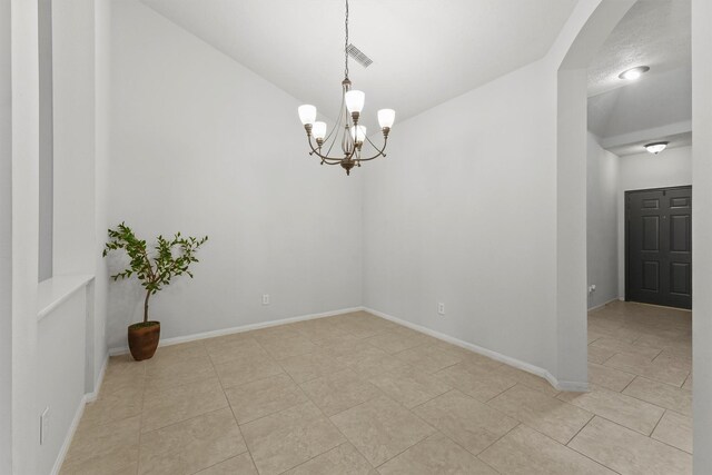 21327 Hadrian Dr, Katy, TX 77449 - spare room featuring a chandelier, light tile patterned flooring, vaulted ceiling, and arched walkways