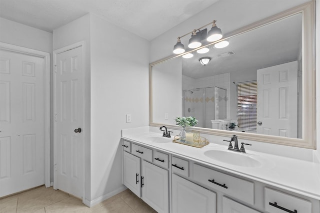 21327 Hadrian Dr, Katy, TX 77449 - full bathroom with double vanity, a shower stall, and tile patterned floors
