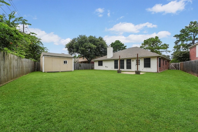 21327 Hadrian Dr, Katy, TX 77449 - back of house with a fenced backyard, a chimney, and a storage unit