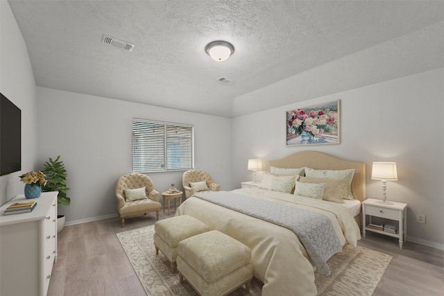 21327 Hadrian Dr, Katy, TX 77449 - bedroom featuring light wood-type flooring and a textured ceiling