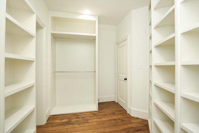 764 Kuhlman Rd, Hunters Creek Village, TX 77024 - walk in closet with dark wood-type flooring