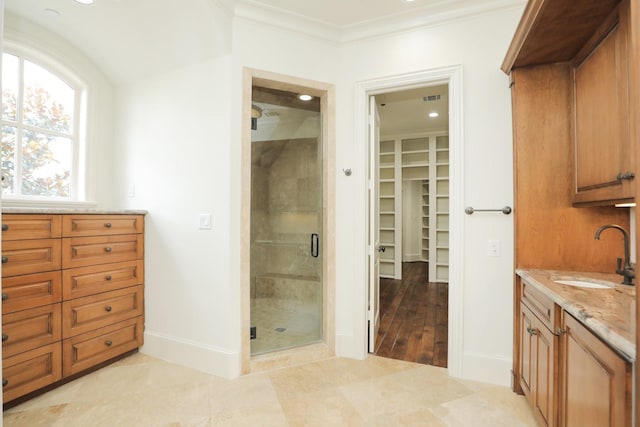 764 Kuhlman Rd, Hunters Creek Village, TX 77024 - full bath featuring a shower stall, vanity, a walk in closet, ornamental molding, and tile patterned floors