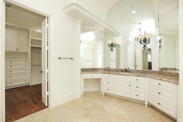 764 Kuhlman Rd, Hunters Creek Village, TX 77024 - bathroom with a chandelier, vanity, a spacious closet, and recessed lighting