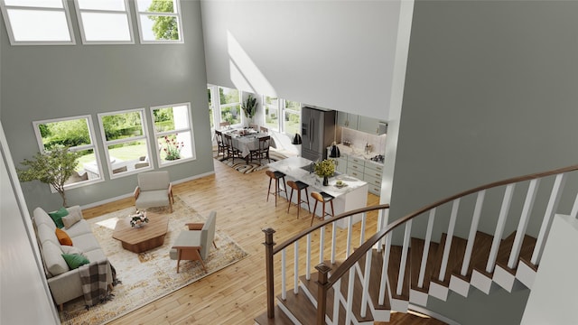2905 Apple Rose, Katy, TX 77493 - stairs with a high ceiling and wood finished floors