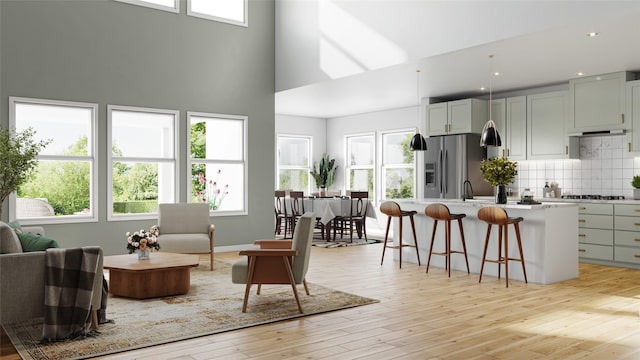 2905 Apple Rose, Katy, TX 77493 - living room with a high ceiling, light wood-type flooring, and recessed lighting