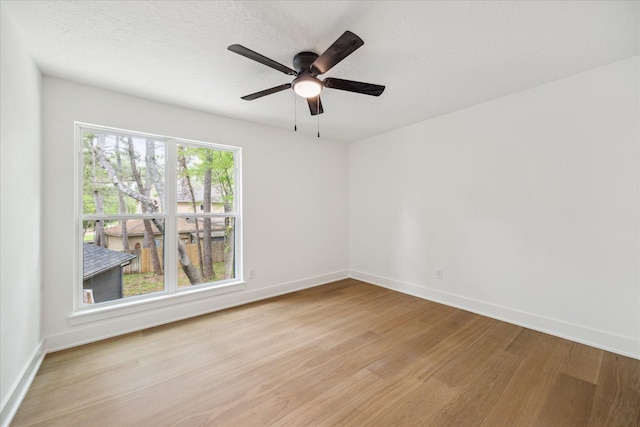 52 Indian Clover, The Woodlands, TX 77381 - spare room featuring light wood-style flooring and ceiling fan