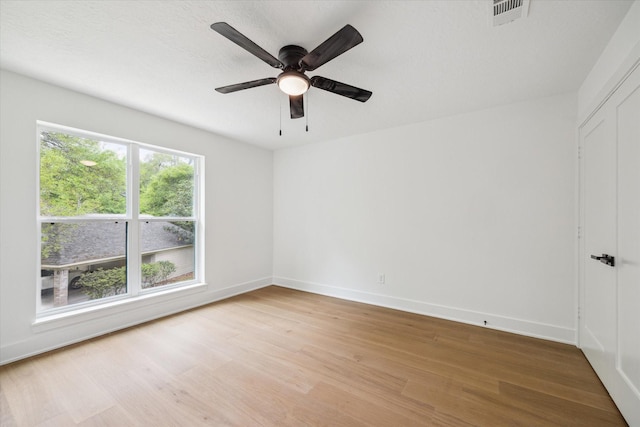 52 Indian Clover, The Woodlands, TX 77381 - empty room featuring light wood-style floors and a ceiling fan