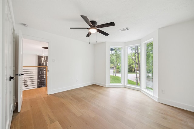 52 Indian Clover, The Woodlands, TX 77381 - unfurnished room featuring light wood-style flooring and ceiling fan