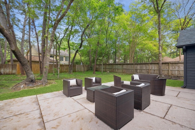 52 Indian Clover, The Woodlands, TX 77381 - fenced backyard featuring an outdoor hangout area and a patio
