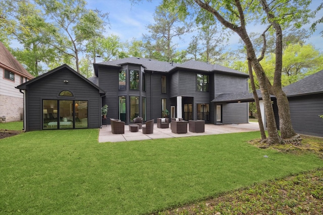 52 Indian Clover, The Woodlands, TX 77381 - rear view of property featuring an outdoor hangout area, a patio area, and a yard