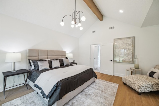 52 Indian Clover, The Woodlands, TX 77381 - bedroom with wood finished floors, beamed ceiling, high vaulted ceiling, and a chandelier