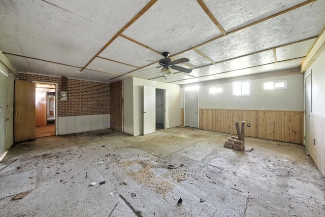 3819 Galway Ln, Houston, TX 77080 - spare room featuring brick wall and a wainscoted wall