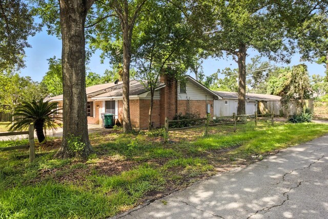 3819 Galway Ln, Houston, TX 77080 - view of side of property featuring brick siding and a chimney