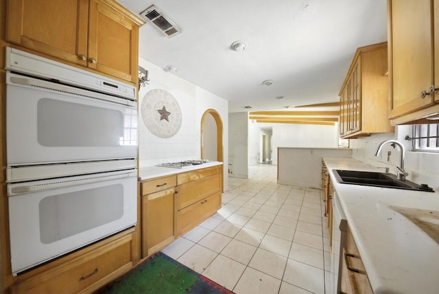 3819 Galway Ln, Houston, TX 77080 - kitchen featuring double oven, light countertops, and light tile patterned floors