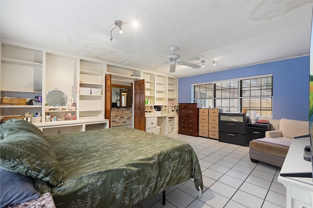 727 Baltic Ln, Houston, TX 77090 - bedroom with track lighting, light tile patterned flooring, and a textured ceiling