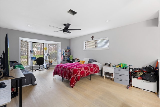 727 Baltic Ln, Houston, TX 77090 - bedroom featuring wood finished floors, ceiling fan, and recessed lighting