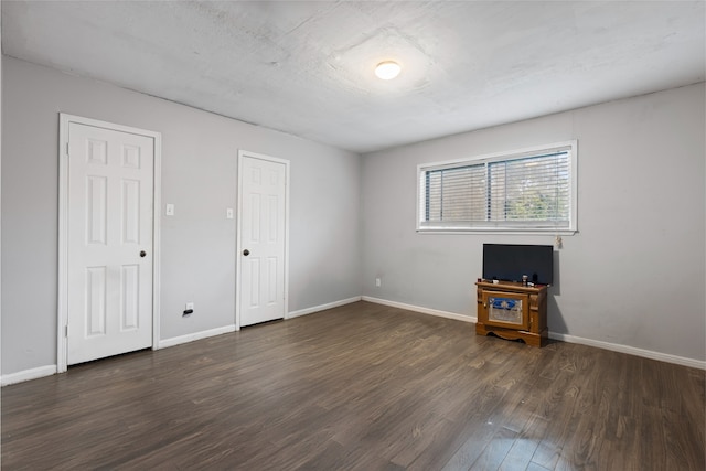 727 Baltic Ln, Houston, TX 77090 - spare room with dark wood-style flooring and baseboards