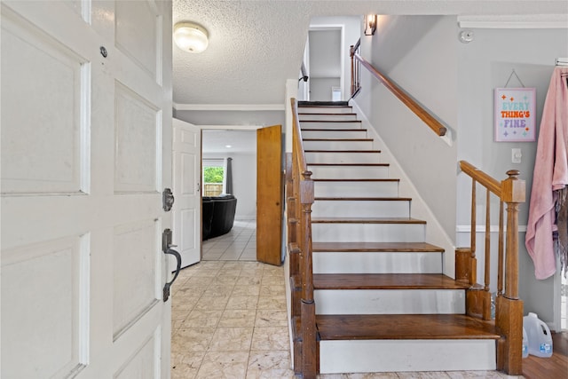 727 Baltic Ln, Houston, TX 77090 - stairway with a textured ceiling
