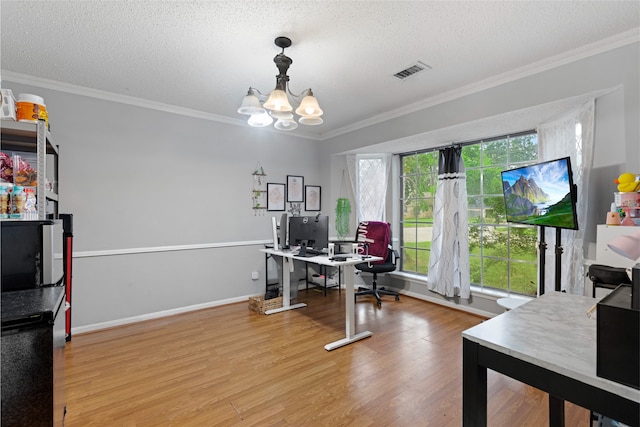 727 Baltic Ln, Houston, TX 77090 - office with a chandelier, wood finished floors, ornamental molding, and a textured ceiling