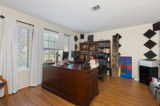 727 Baltic Ln, Houston, TX 77090 - office space featuring wood finished floors, healthy amount of natural light, a textured ceiling, and ornamental molding