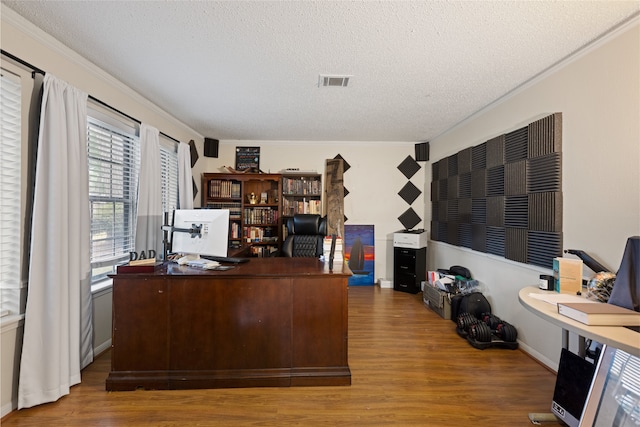 727 Baltic Ln, Houston, TX 77090 - office space with wood finished floors, a textured ceiling, and crown molding