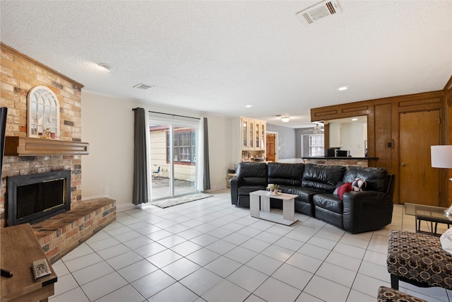 727 Baltic Ln, Houston, TX 77090 - living area featuring light tile patterned floors, a fireplace, and a textured ceiling