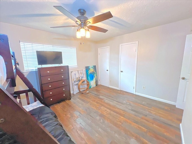 6305 Westward St Unit 106, Houston, TX 77081 - bedroom featuring wood finished floors and ceiling fan