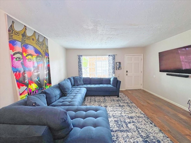 6305 Westward St Unit 106, Houston, TX 77081 - living area featuring wood finished floors and a textured ceiling