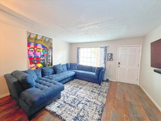6305 Westward St Unit 106, Houston, TX 77081 - living area featuring a textured ceiling and wood finished floors