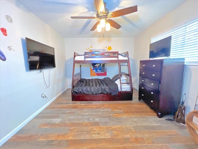 6305 Westward St Unit 106, Houston, TX 77081 - bedroom featuring wood finished floors and a ceiling fan
