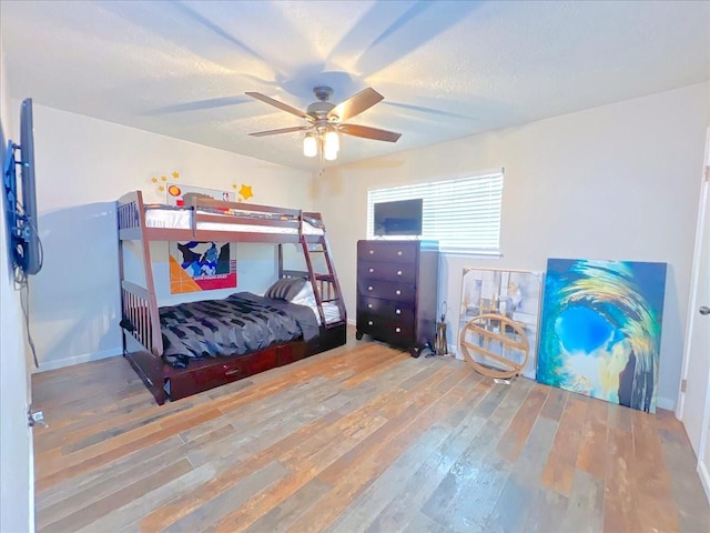 6305 Westward St Unit 106, Houston, TX 77081 - bedroom featuring wood finished floors and ceiling fan