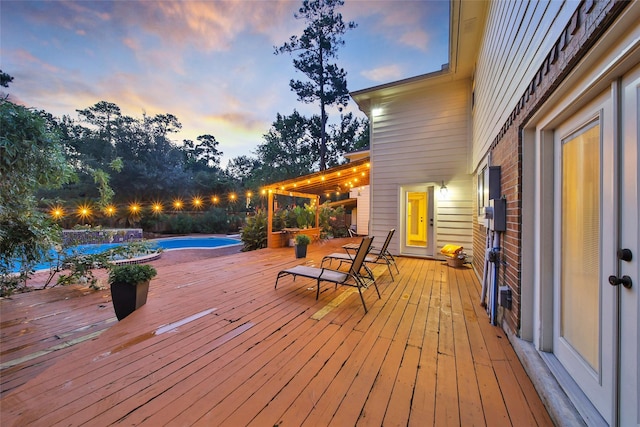 10 Featherfall Pl, Spring, TX 77381 - deck at dusk featuring an outdoor pool