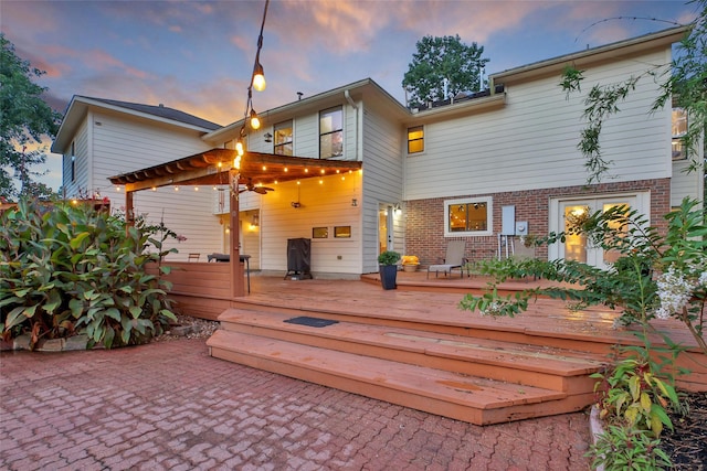10 Featherfall Pl, Spring, TX 77381 - back of house featuring a wooden deck, brick siding, and a patio area
