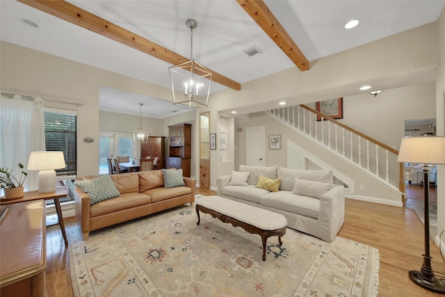 10 Featherfall Pl, Spring, TX 77381 - living area with a chandelier, wood finished floors, stairway, beam ceiling, and recessed lighting