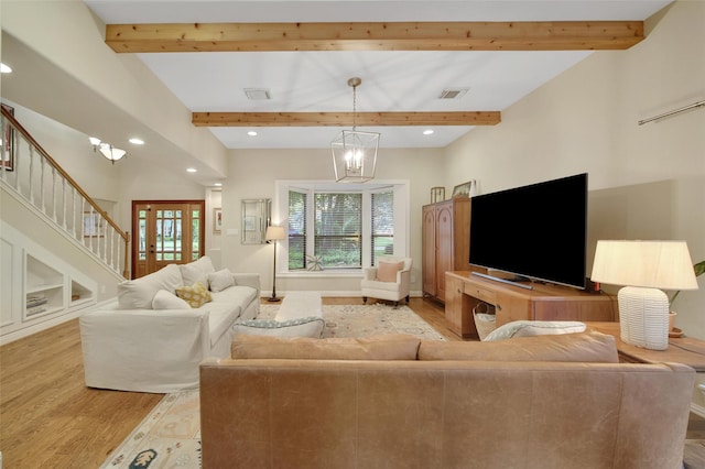 10 Featherfall Pl, Spring, TX 77381 - living area featuring light wood-type flooring, beamed ceiling, recessed lighting, a chandelier, and stairs