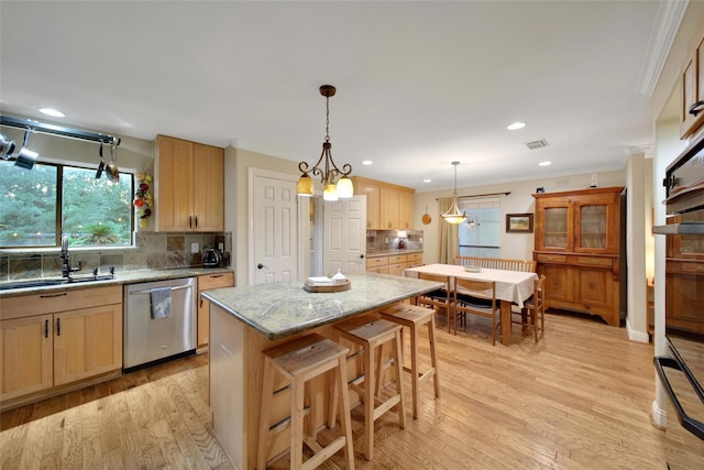 10 Featherfall Pl, Spring, TX 77381 - kitchen featuring crown molding, dishwasher, recessed lighting, light wood-style flooring, and decorative backsplash