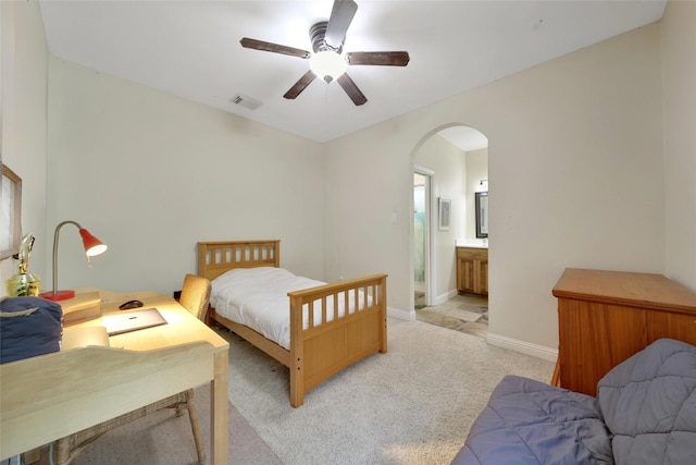 10 Featherfall Pl, Spring, TX 77381 - bedroom featuring arched walkways, light colored carpet, ensuite bathroom, and ceiling fan